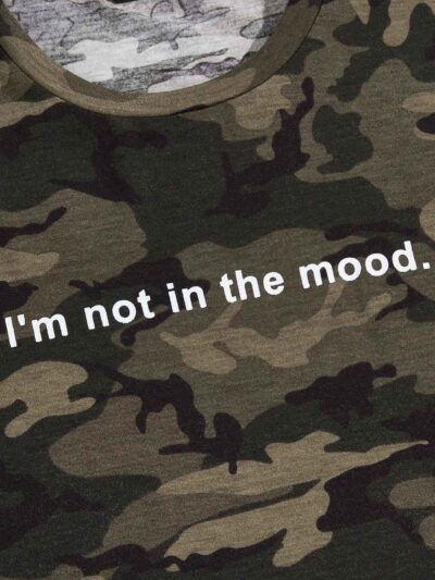 Men's camo tee with bold slogan graphic. Notice the quality stitching and soft cotton texture. Short-sleeved, relaxed fit. -