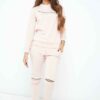 Nude loungewear set. Soft, slightly fuzzy texture. Front zipper pullover and matching pants. Delicate stitching. Comfortable