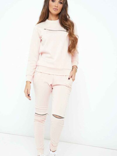 Nude loungewear set. Soft, slightly fuzzy texture. Front zipper pullover and matching pants. Delicate stitching. Comfortable