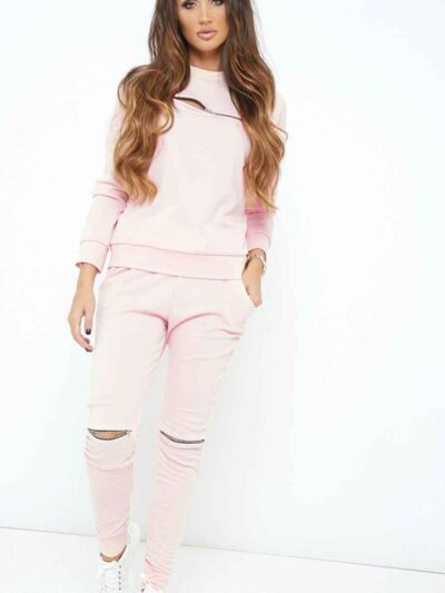 Nude loungewear set. Soft, slightly fuzzy texture. Front zipper pullover and matching pants. Delicate stitching. Comfortable
