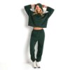Women's tracksuit set. Soft, breathable fabric with subtle sheen. Athletic fit, clean stitching. Quick-dry sweatpants and jac