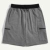 Camo beach shorts. Lightweight, breathable fabric with detailed stitching. Green, brown, and tan camouflage print. Elastic wa
