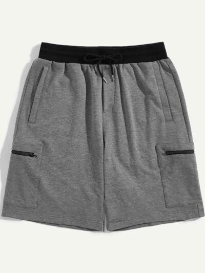 Camo beach shorts. Lightweight, breathable fabric with detailed stitching. Green, brown, and tan camouflage print. Elastic wa