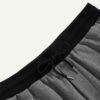 Camo beach shorts. Lightweight, breathable fabric with detailed stitching. Green, brown, and tan camouflage print. Elastic wa