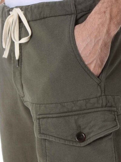 Men's vibrant swim trunks with breathable mesh lining. Close up shows sturdy stitching and quick-drying fabric. Ideal for res