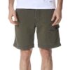 Men's vibrant swim trunks with breathable mesh lining. Close up shows sturdy stitching and quick-drying fabric. Ideal for res
