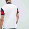 Close-up of a business casual polo shirt. Notice the fine knit fabric texture, clean stitching, and subtle color variations i