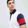 Close-up of a business casual polo shirt. Notice the fine knit fabric texture, clean stitching, and subtle color variations i