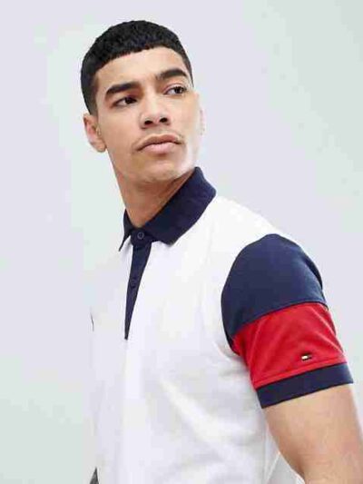 Close-up of a business casual polo shirt. Notice the fine knit fabric texture, clean stitching, and subtle color variations i