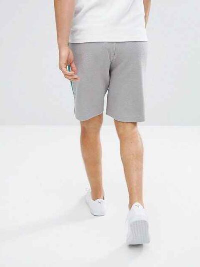 Lightweight resort shorts in a tropical print, featuring a comfortable elastic waistband and clean, durable stitching. Ideal