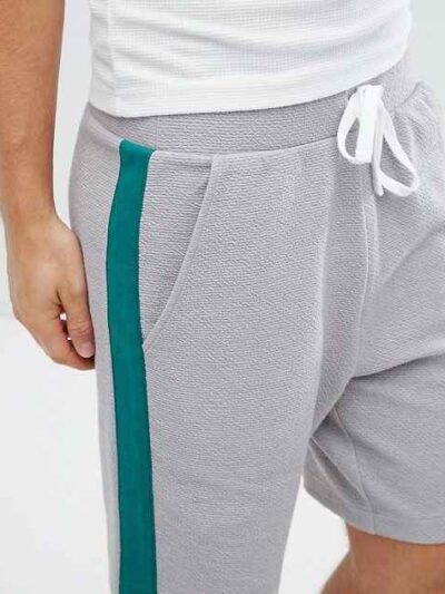 Lightweight resort shorts in a tropical print, featuring a comfortable elastic waistband and clean, durable stitching. Ideal