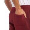 Durable cotton training shorts; close-up reveals robust stitching, soft fabric texture. Ideal workwear in neutral tones. - Vi