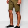 Heavyweight cotton shorts, relaxed fit. Notice the textured fabric, reinforced stitching, and subtle color variations. Casual