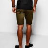Heavyweight cotton shorts, relaxed fit. Notice the textured fabric, reinforced stitching, and subtle color variations. Casual