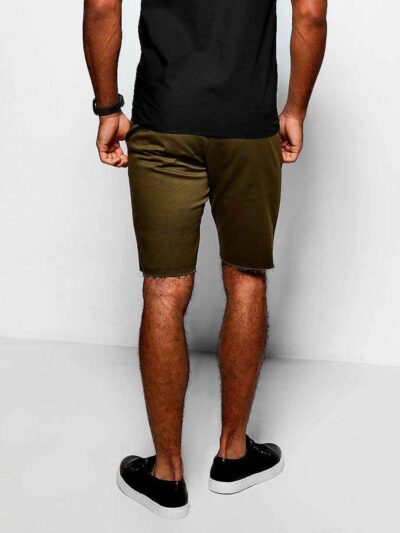 Heavyweight cotton shorts, relaxed fit. Notice the textured fabric, reinforced stitching, and subtle color variations. Casual