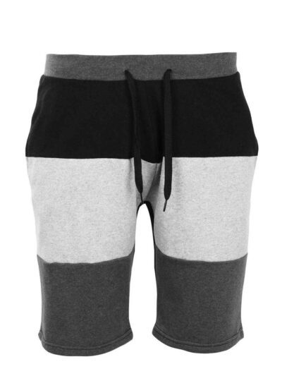 Close-up of charcoal sweat shorts featuring a raised, detailed embroidered logo. Soft, looped-back cotton fabric. Premium sti