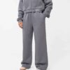 Cropped zip hoodie and sweatpants set. Soft, peach-fuzz fabric. Visible stitching detail. Sporty, feminine loungewear in blus