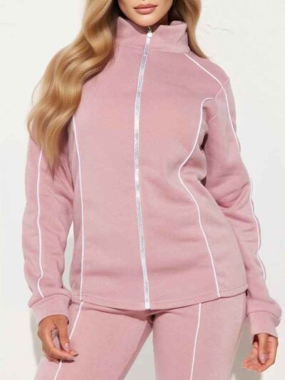 Ladies' hooded tracksuit. Smooth, slightly textured fabric, likely polyester blend. Close-fitting design with clean stitching