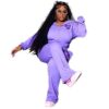 Ladies tracksuit set. Fitted jogger pants & zip-up jacket. Blush pink hue, subtle ribbed texture, clean stitching detail. Fit