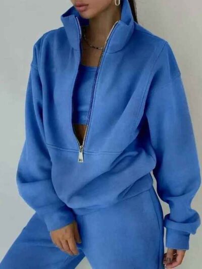 Luxury ladies' tracksuit: soft knit fabric, tailored stitching. Subtle color variation, custom label visible. Comfy, chic sty