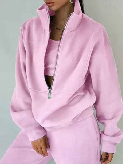 Luxury ladies' tracksuit: soft knit fabric, tailored stitching. Subtle color variation, custom label visible. Comfy, chic sty