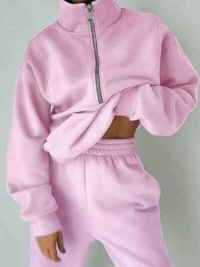 Luxury ladies' tracksuit: soft knit fabric, tailored stitching. Subtle color variation, custom label visible. Comfy, chic sty