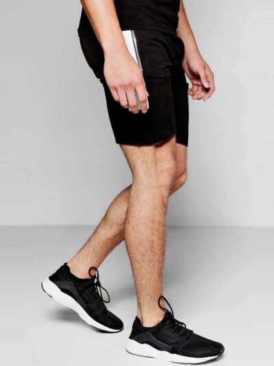 Lightweight travel shorts in a neutral tone, showing fine stitching and a soft, breathable fabric. Ideal casual apparel for v