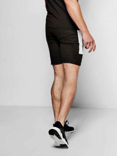 Lightweight travel shorts in a neutral tone, showing fine stitching and a soft, breathable fabric. Ideal casual apparel for v
