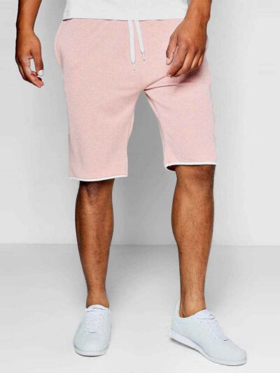 Luxury streetwear shorts, close-up. Black heavy cotton blend, rhinestone logo detail, reinforced stitching. High-end design.