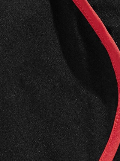 Crimson mesh basketball shorts, textured weave visible. White trim accents. Reinforced stitching. Breathable sport uniform ga