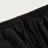 Crimson mesh basketball shorts, textured weave visible. White trim accents. Reinforced stitching. Breathable sport uniform ga