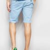 Vibrant Hawaiian print swim board shorts with a slightly textured, quick-dry fabric. Notice the reinforced stitching and comf