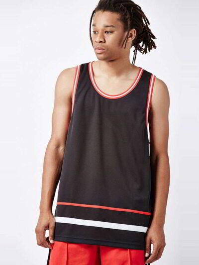 Close-up of a soft, cotton tank top. Fine stitching highlights the armhole. Breathable, lightweight fabric in a heathered gre