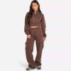 Women's two-piece tracksuit. Soft heather gray fabric, ribbed cuffs. Casual sweat suit with clean stitching and a comfortable