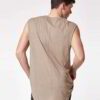 Close-up of a finely stitched, breathable singlet. Soft, slightly textured knit fabric in vibrant turquoise. Sporty, sleevele