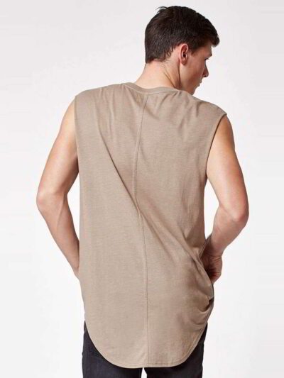 Close-up of a finely stitched, breathable singlet. Soft, slightly textured knit fabric in vibrant turquoise. Sporty, sleevele
