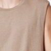 Close-up of a finely stitched, breathable singlet. Soft, slightly textured knit fabric in vibrant turquoise. Sporty, sleevele