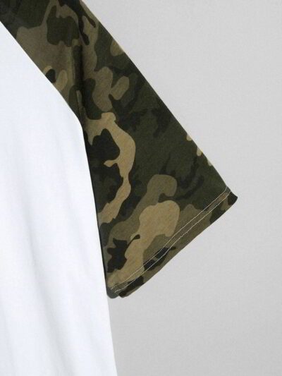 Close-up of a custom-printed t-shirt. Soft jersey knit texture, clean seams. Noticeable print quality, vibrant colors on a da