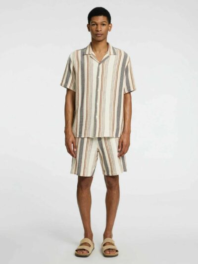 Vintage men's streetwear short set in washed cotton. Relaxed fit, visible stitching, slightly faded effect for a lived-in loo