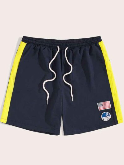 Navy swim trunks, quick-dry fabric with subtle sheen. Note reinforced stitching & clean silhouette. Ideal resort apparel. - V