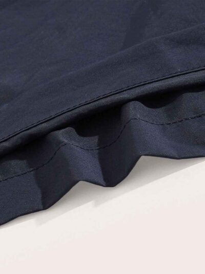 Navy swim trunks, quick-dry fabric with subtle sheen. Note reinforced stitching & clean silhouette. Ideal resort apparel. - V