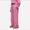 Women's tracksuit set in muted tones. Visible fine stitching, soft-looking knit fabric. Corporate uniform or team wear. - Vie