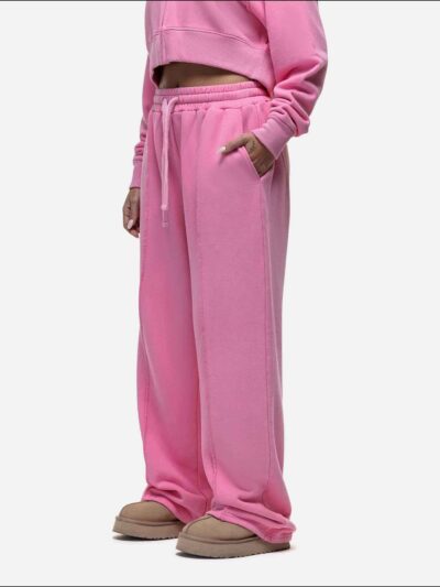 Women's tracksuit set in muted tones. Visible fine stitching, soft-looking knit fabric. Corporate uniform or team wear. - Vie