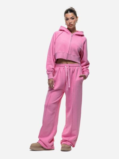 Women's tracksuit set in muted tones. Visible fine stitching, soft-looking knit fabric. Corporate uniform or team wear. - Vie