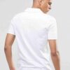 Close-up of open-collar polo shirt; textured fabric, clean stitching, sporty design. Perfect for club uniforms. Team apparel.