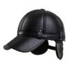 Close-up of a brown golf hat in textured PU leather with earflaps. Adjustable strap visible; fine stitching detail. - View 1