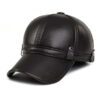 Close-up of a brown golf hat in textured PU leather with earflaps. Adjustable strap visible; fine stitching detail. - View 2