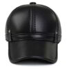 Close-up of a brown golf hat in textured PU leather with earflaps. Adjustable strap visible; fine stitching detail. - View 3