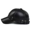 Close-up of a brown golf hat in textured PU leather with earflaps. Adjustable strap visible; fine stitching detail. - View 7
