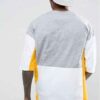 Oversized t-shirt with color block panels and embroidered text. Close up shows soft texture, quality stitching, and relaxed f